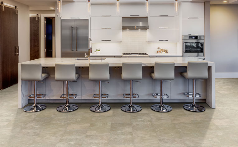 tile in kitchen area with island and chairs